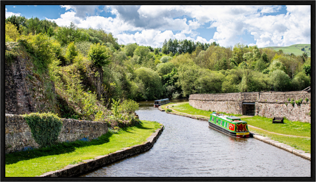 Southern Arm of the Bugsworth Basin with green narrow boat moored.