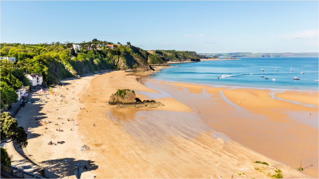 Tenby Beach, the tide is out showing dry and wet sand